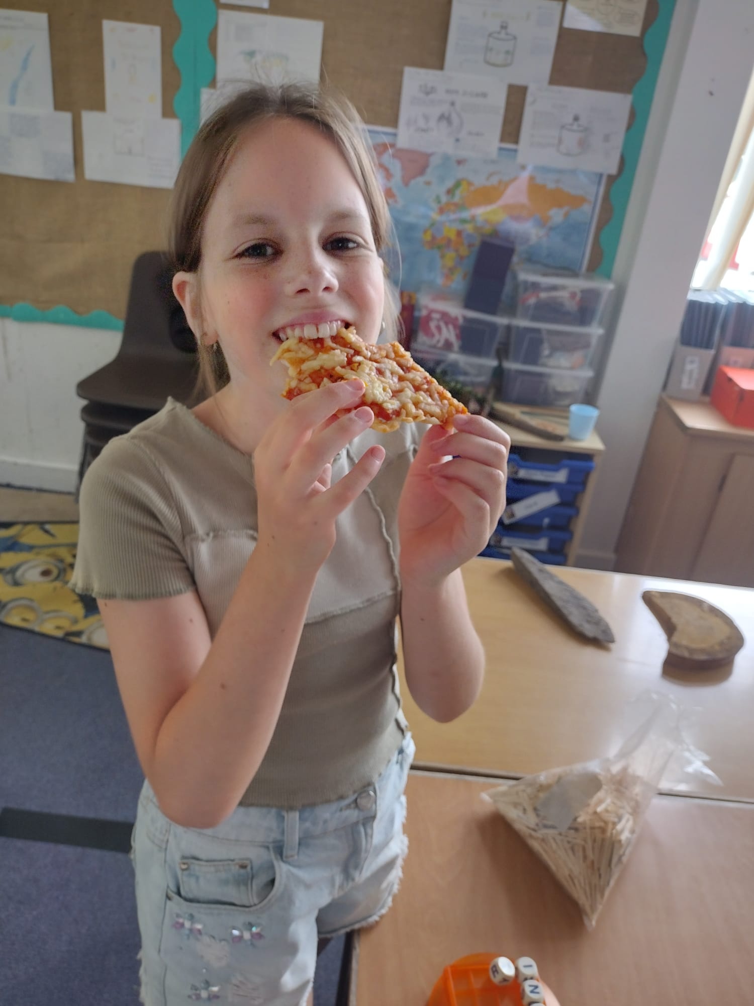 A girl eats pizza