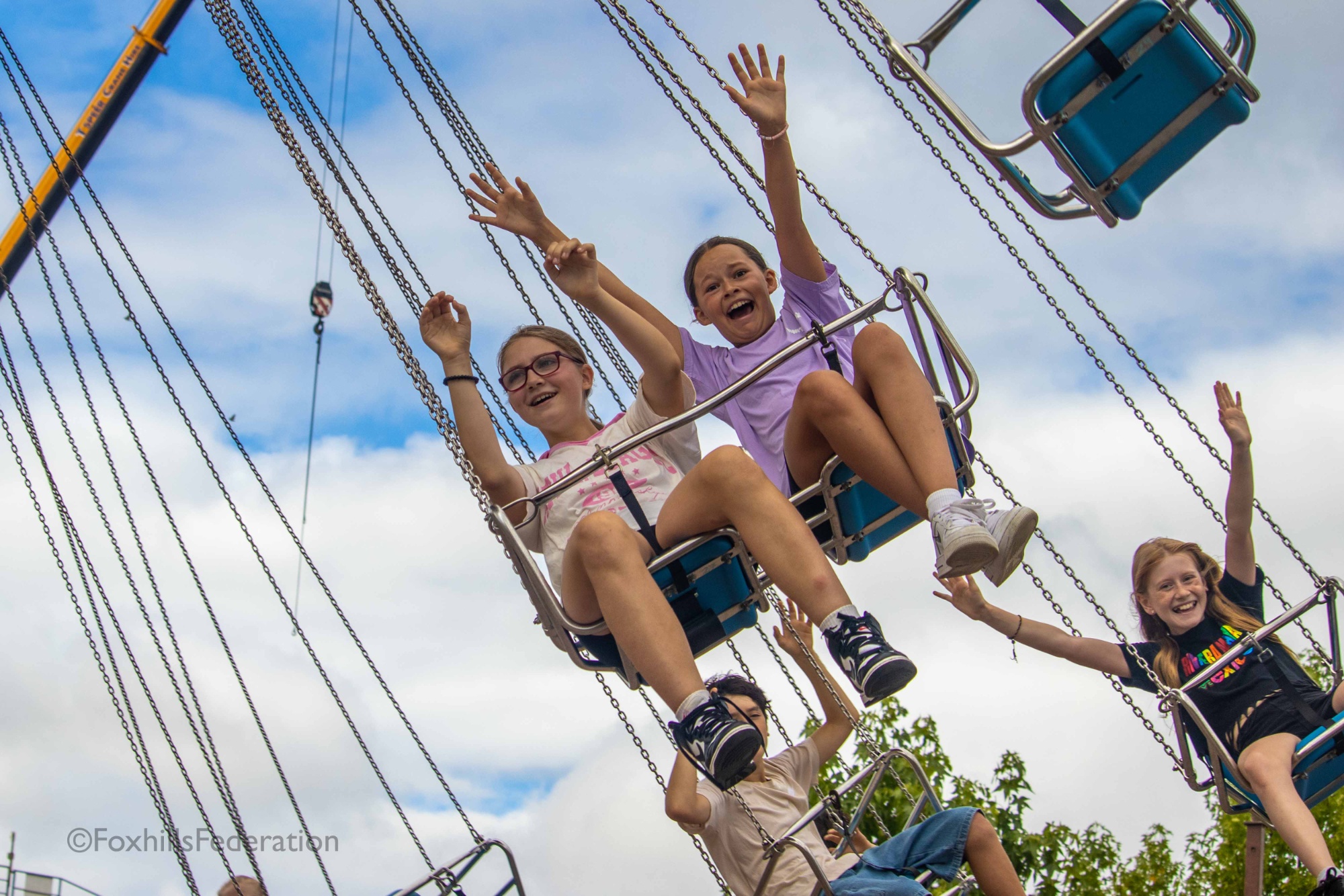 Children ride a swing ride