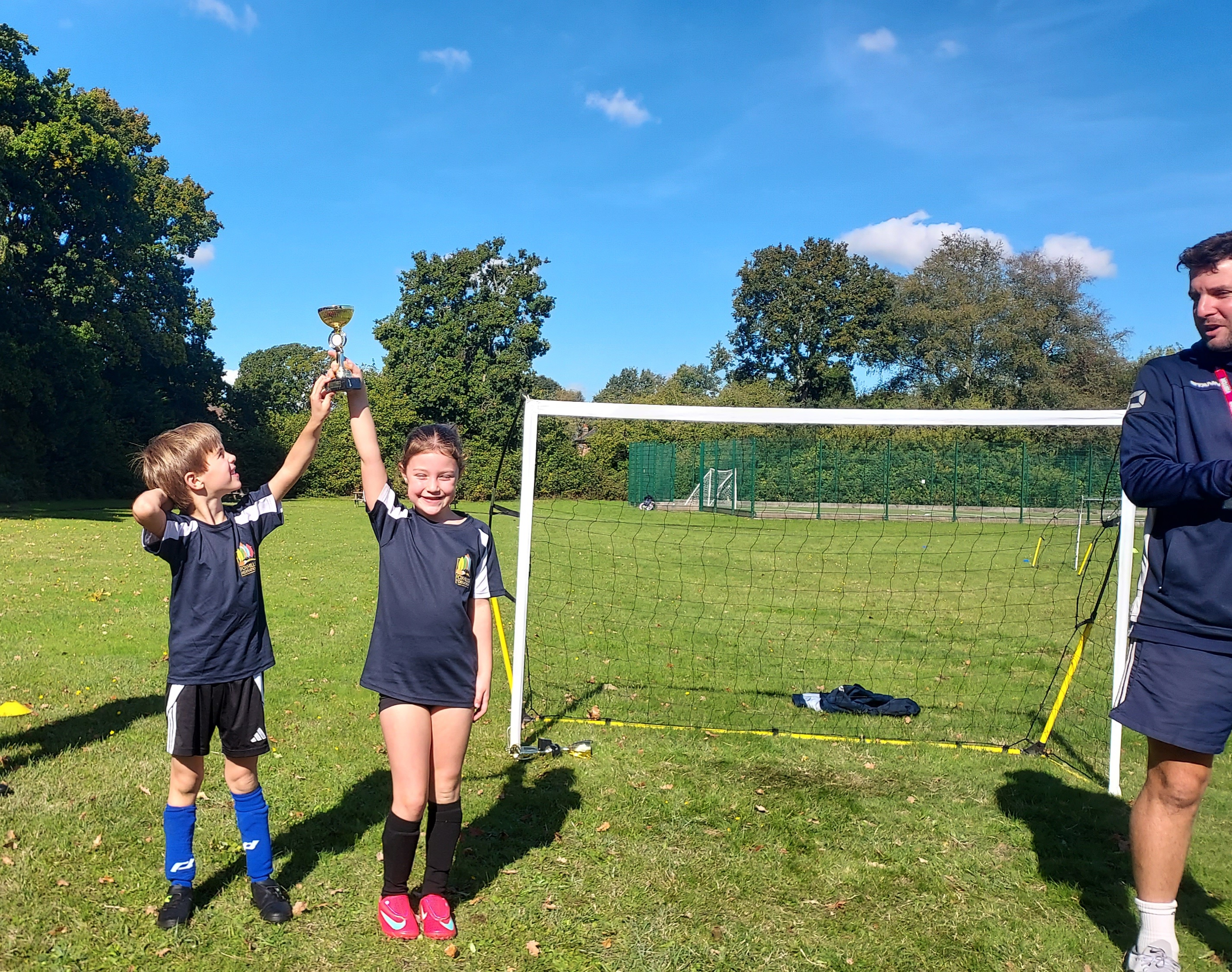Girls holding trophy